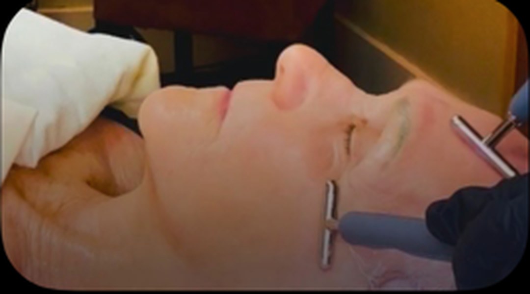 Microcurrent facial toning treatment with handheld probes