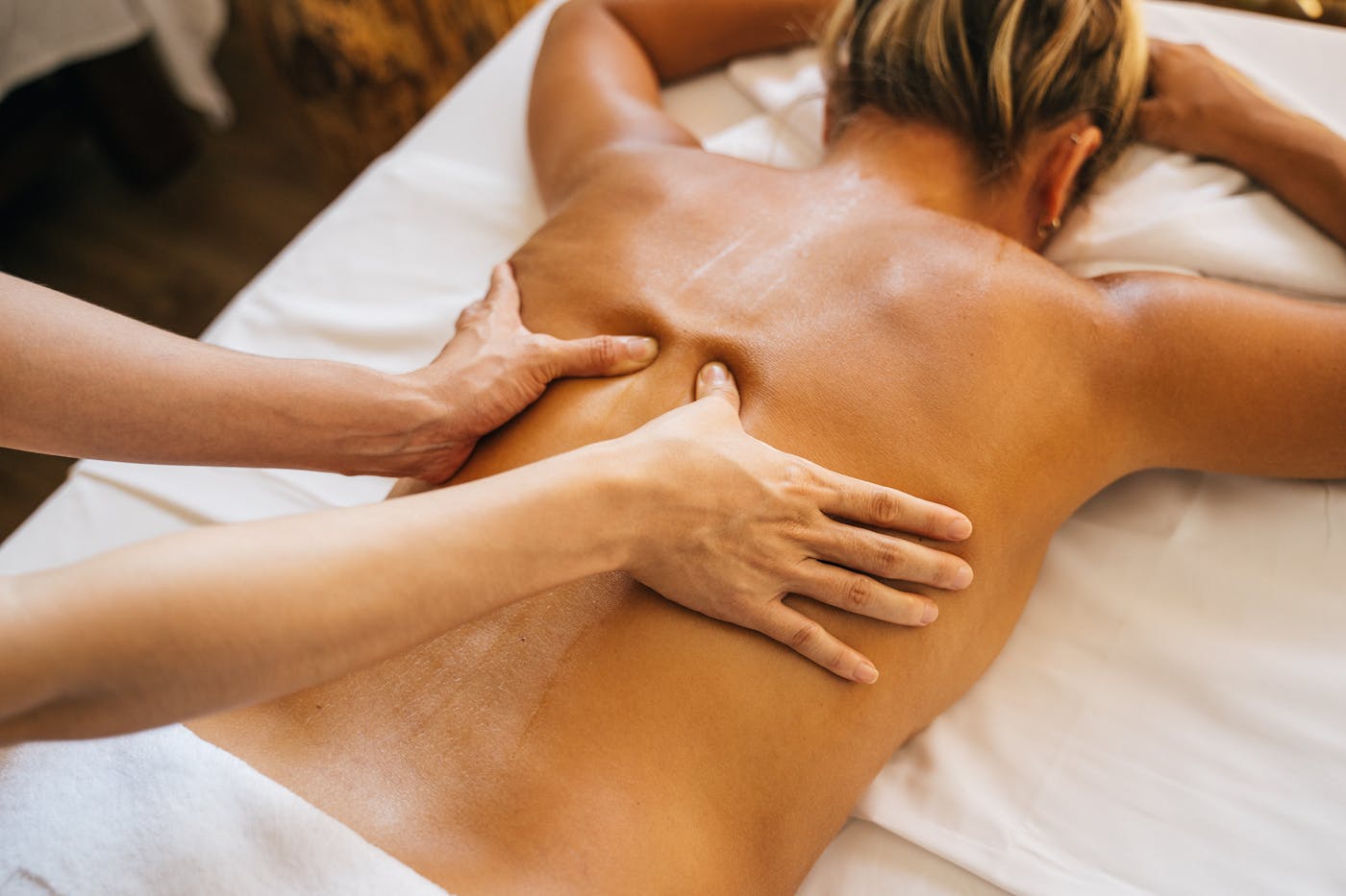 Therapeutic massage session focused on back and shoulder work
